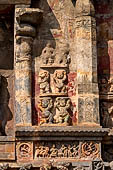 The great Chola temples of Tamil Nadu - The Airavatesvara temple of Darasuram. Panel with dwarf attendant figures flanking the niches on the south wall of the sanctuary.